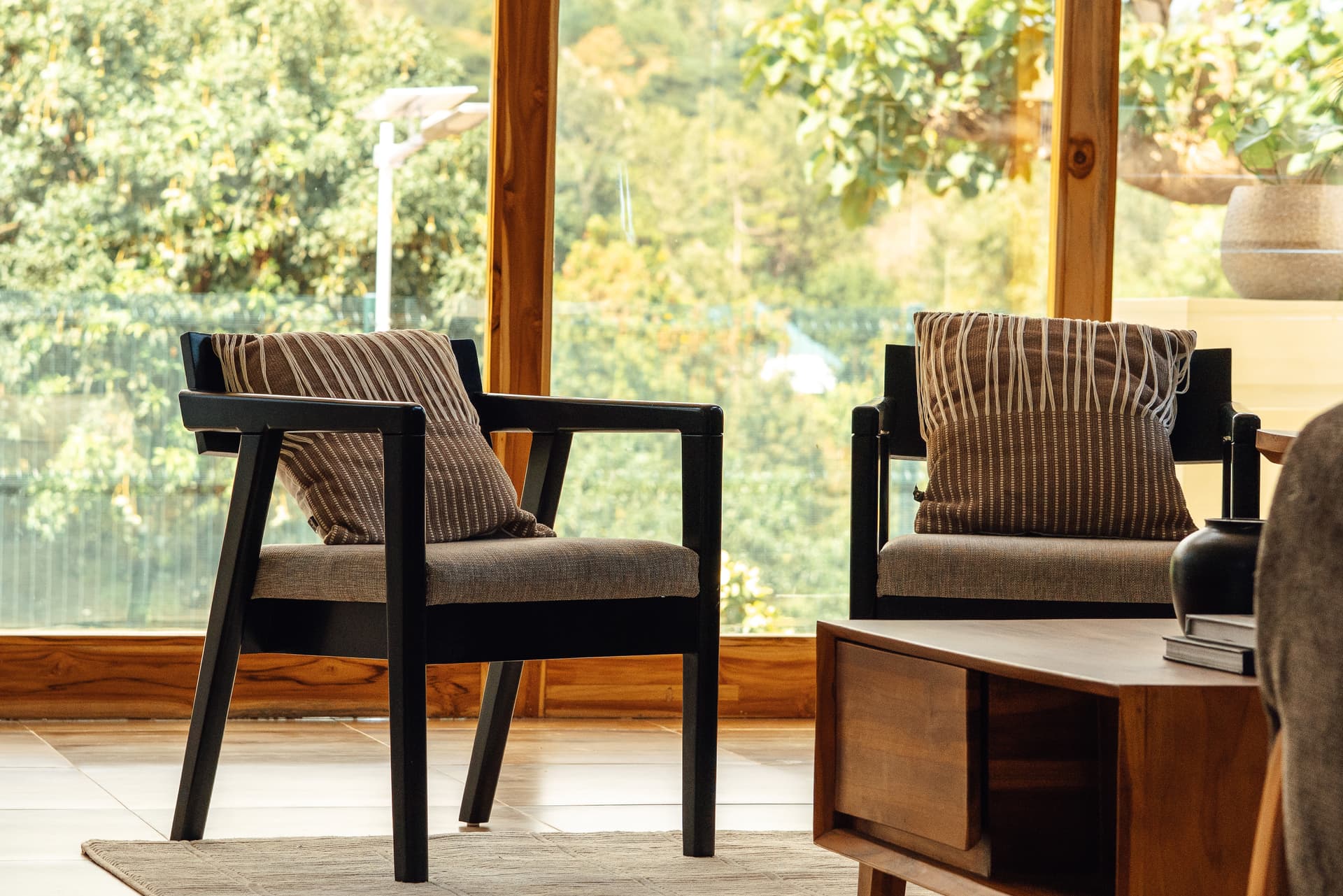 Lounge chairs looking out over greenery at Starico Residence